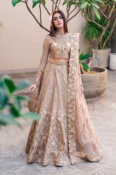 Golden Patel golden Pakistani bridal lehenga choli, full front view with high-neck embellished choli and flared sequin lehenga with zardozi waist belt