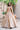 Golden Patel golden formal lehenga choli in a side pose, Pakistani designer wear for wedding guests