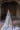 Back view of the Jhoomar misty blue bridal maxi showing the scoop back and long embellished train by Waqas Shah Official