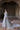 Side view of the Jhoomar misty blue bridal maxi with a flowing embellished train by Waqas Shah Official