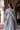 Jhoomar misty blue bridal maxi with embroidered net dupatta draped over the shoulder by Waqas Shah Official