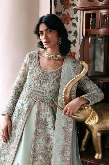 Waist-up view of the Laila mint green bridal maxi showing the scoop neckline and pearl, crystal and rose gold sequin bodice