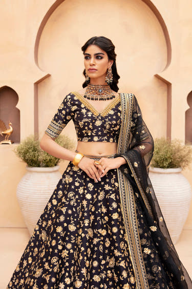 Lakshmi black raw silk lehenga choli with tilla floral motifs and embellished organza dupatta