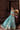 Complete luxury teal and turquoise Pakistani lehenga choli featuring embroidered velvet, hand-embellished choli and organza dupatta.

