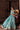 Complete luxury teal and turquoise Pakistani lehenga choli featuring embroidered velvet, hand-embellished choli and organza dupatta.
