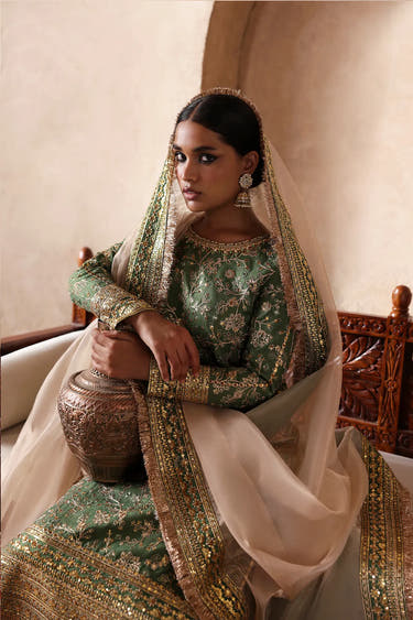 Luxury Pakistani formal wear by Waqas Shah Official featuring sage green embroidery, premium craftsmanship, and an elegant designer silhouette for special occasions.