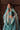 Luxury teal and turquoise Pakistani bridal dress handcrafted in Lahore, Pakistan featuring premium velvet, traditional embroidery and refined hand embellishments.
