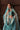 Luxury teal and turquoise Pakistani bridal dress handcrafted in Lahore, Pakistan featuring premium velvet, traditional embroidery and refined hand embellishments.
