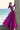 Side profile of the Lyric magenta formal lehenga showing the full flared skirt covered in sequin and bead handwork