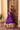 Back view of the Mahrang purple lehenga choli with gold tassel ties