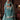 Manzil luxury teal and turquoise Pakistani bridal lehenga by Waqas Shah Official featuring a richly embroidered velvet ensemble with intricate jaal work.
