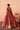 Back view of the Mastani red lehenga choli showing the scooped neckline with dabka and pearl work