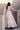 Back view of the Mystic Rose white bridal lehenga choli with the sheer dupatta falling behind