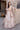 Mystic Rose white bridal lehenga showing the rose gold zardozi and sequin embroidery all over the skirt