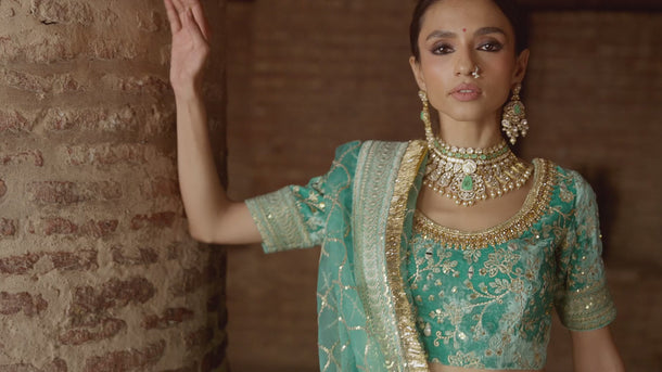 Manzil teal and turquoise velvet Pakistani bridal lehenga choli in motion
