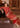 Red formal dress with intricate beige and golden threadwork by Waqas Shah Official