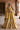 Resham yellow Pakistani mehndi lehenga choli, full front view with organza dupatta over the head and golden tilla embroidery