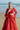Ruby red formal lehenga choli portrait with the dupatta over the shoulder, Pakistani designer wear
