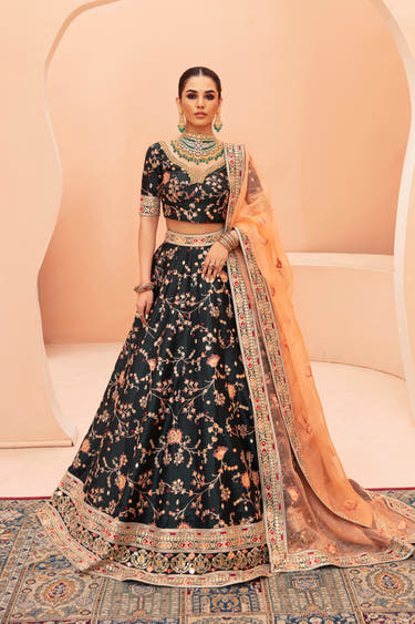 Shah Bano dark green Pakistani mehndi lehenga choli in raw silk, full front view with peach organza dupatta