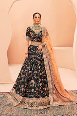 Shah Bano dark green Pakistani mehndi lehenga choli in raw silk, full front view with peach organza dupatta