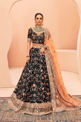 Shah Bano dark green Pakistani mehndi lehenga choli in raw silk, full front view with peach organza dupatta