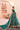 Back view of the Shahrbanu emerald green lehenga choli with the dupatta trailing behind