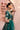 Side view of the Shahrbanu green lehenga choli with golden tilla floral embroidery