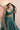 Shahrbanu emerald green mehndi lehenga with the organza dupatta over the head