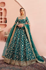 Shahrbanu emerald green Pakistani mehndi lehenga choli, full front view in raw silk with organza dupatta