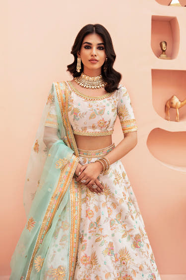 Shahtaaj white mirror work lehenga choli in raw silk with mint organza dupatta