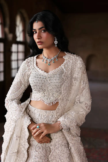 White Beige Pakistani reception dress with handcrafted bridal embroidery by Waqas Shah