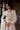 White Beige Pakistani reception dress with handcrafted bridal embroidery by Waqas Shah