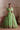 Luxury Pistachio Green Pakistani wedding lehenga featuring premium Raw Silk, floral embroidery, mirror work and an embroidered organza dupatta.
