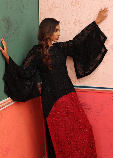 Maroon Raw Silk trouser paired with Black embroidered net shirt by Waqas Shah Official