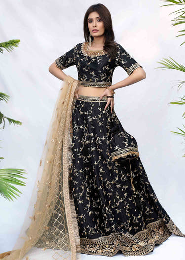 Black Raw Silk bridal lehenga with lotus and Jaal embroidery by Waqas Shah Official