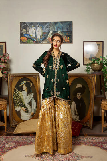 Green Jamawar Sharara paired with a luxurious embellished Velvet shirt by Waqas Shah Official