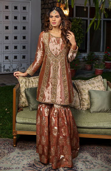 Peach shirt featuring Naqshi Dabka stones Swarovski and bead detailing by Waqas Shah Official