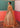 Peach reception dress featuring an open front Net gown and embellished lehenga by Waqas Shah Official